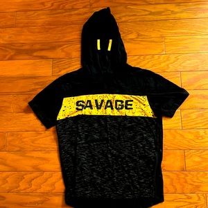 Boys shirt with a hoodie that says savage in the front.